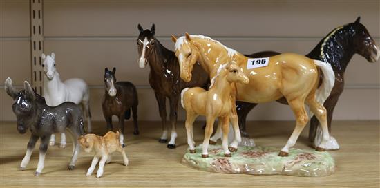 A collection of Beswick horses and donkeys